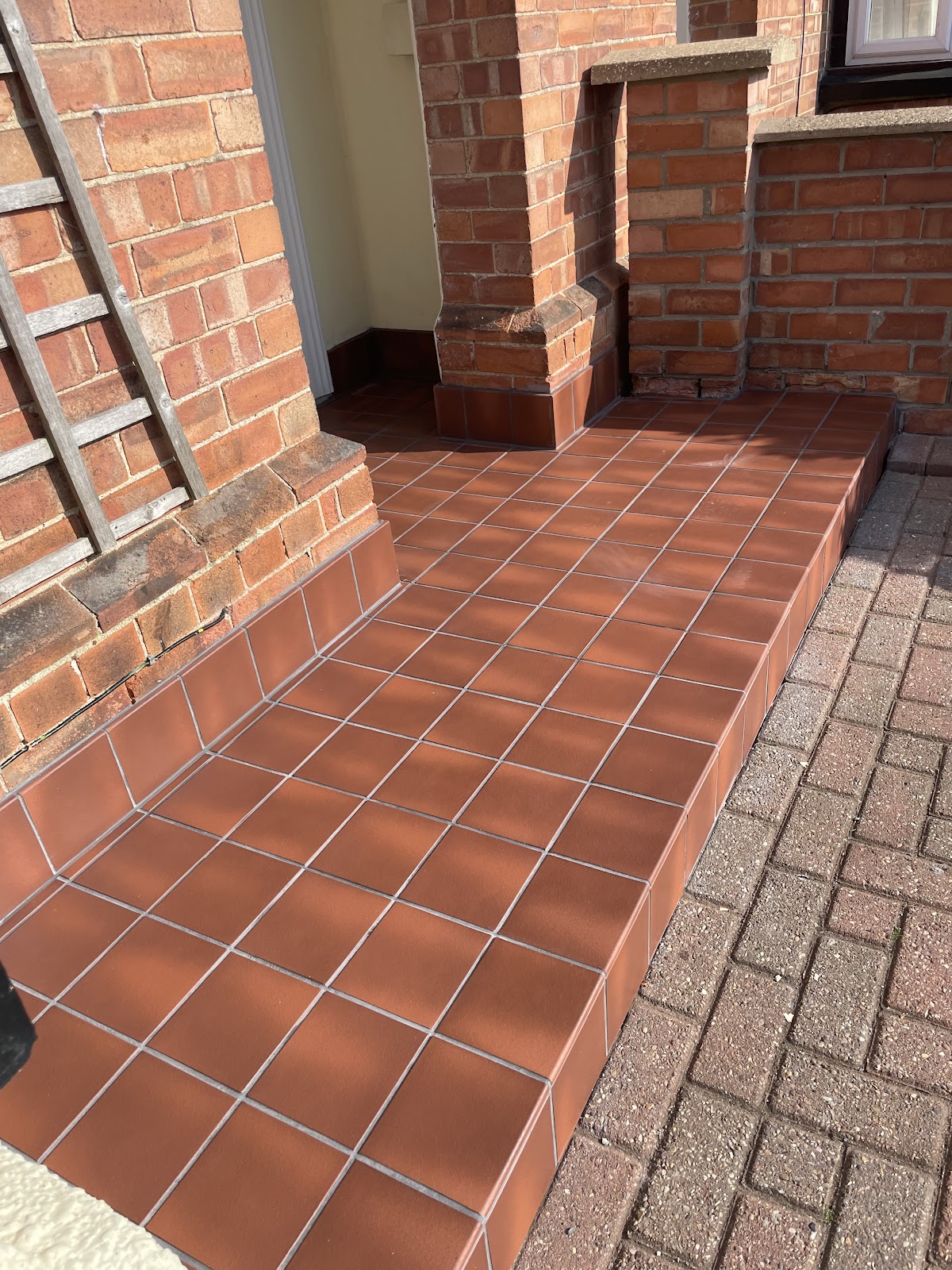 Traditional terracotta quarry-tile front porch